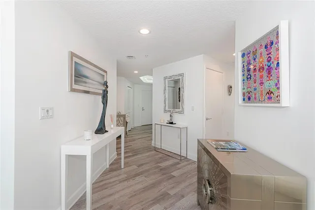 a bathroom with a granite countertop sink mirror and shower