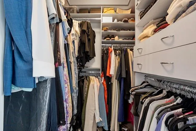 a view of a storage and utility room with washer and dryer