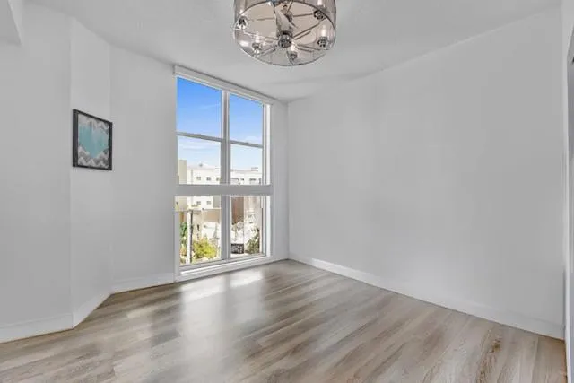 a kitchen with stainless steel appliances granite countertop a refrigerator and a stove