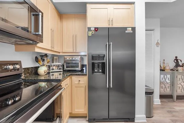 a balcony with a potted plant and outdoor seating