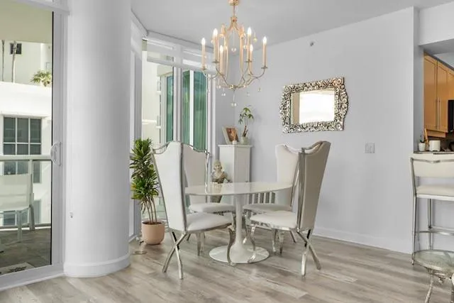 a balcony view with couple of chairs in front of living room