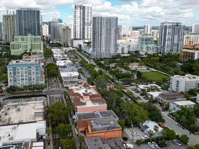 a kitchen with granite countertop a stove sink and microwave