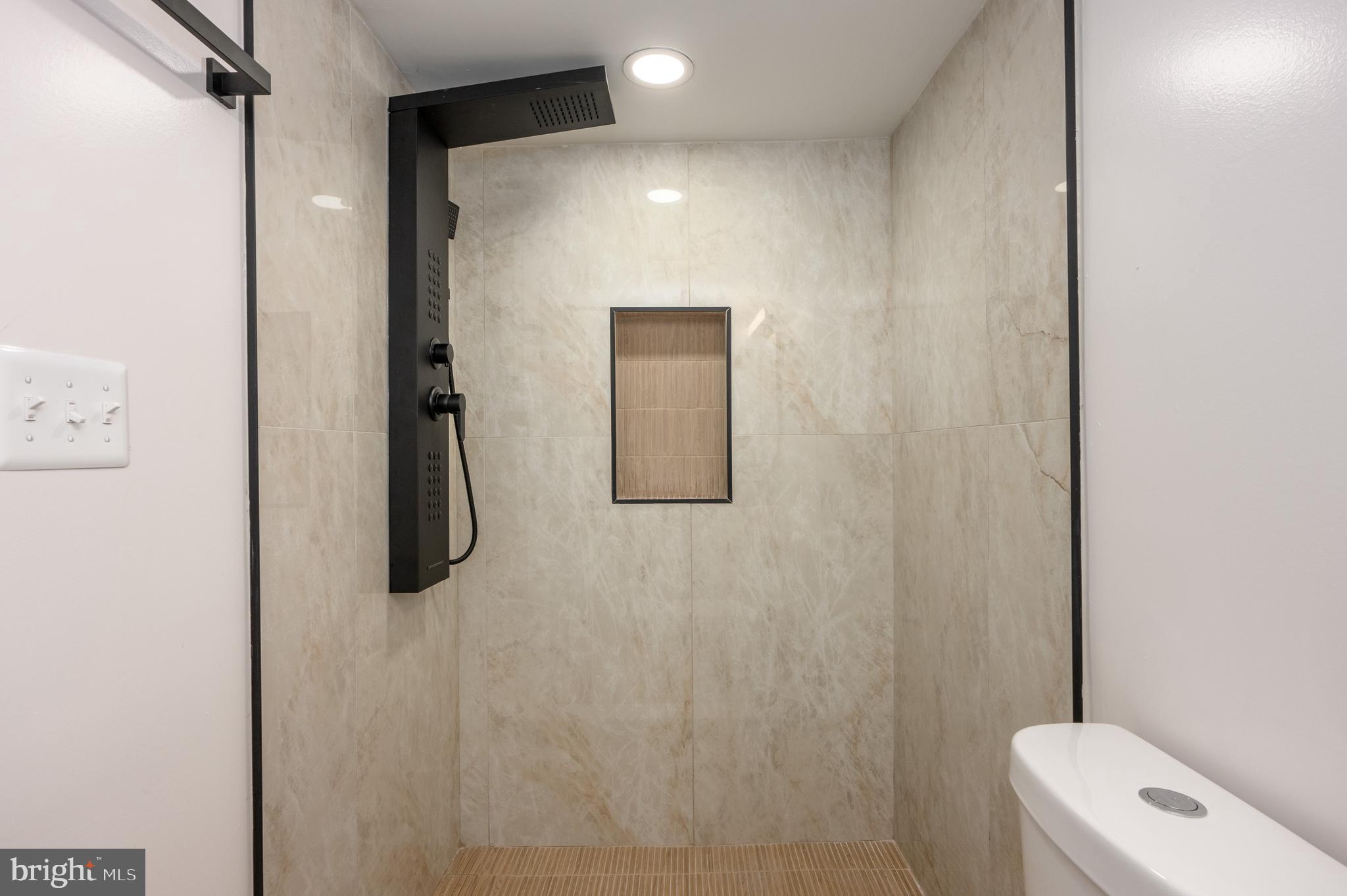 3121 Sequoia Avenue Baltimore, MD 21215 - Photo 26 of 30 a bathroom with a shower and toilet