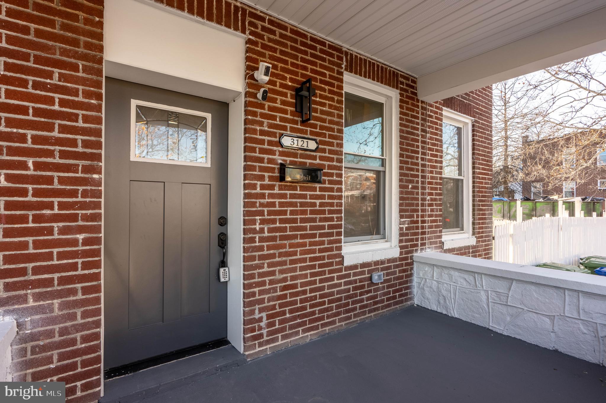 3121 Sequoia Avenue Baltimore, MD 21215 - Photo 4 of 30 a view of a brick house with windows
