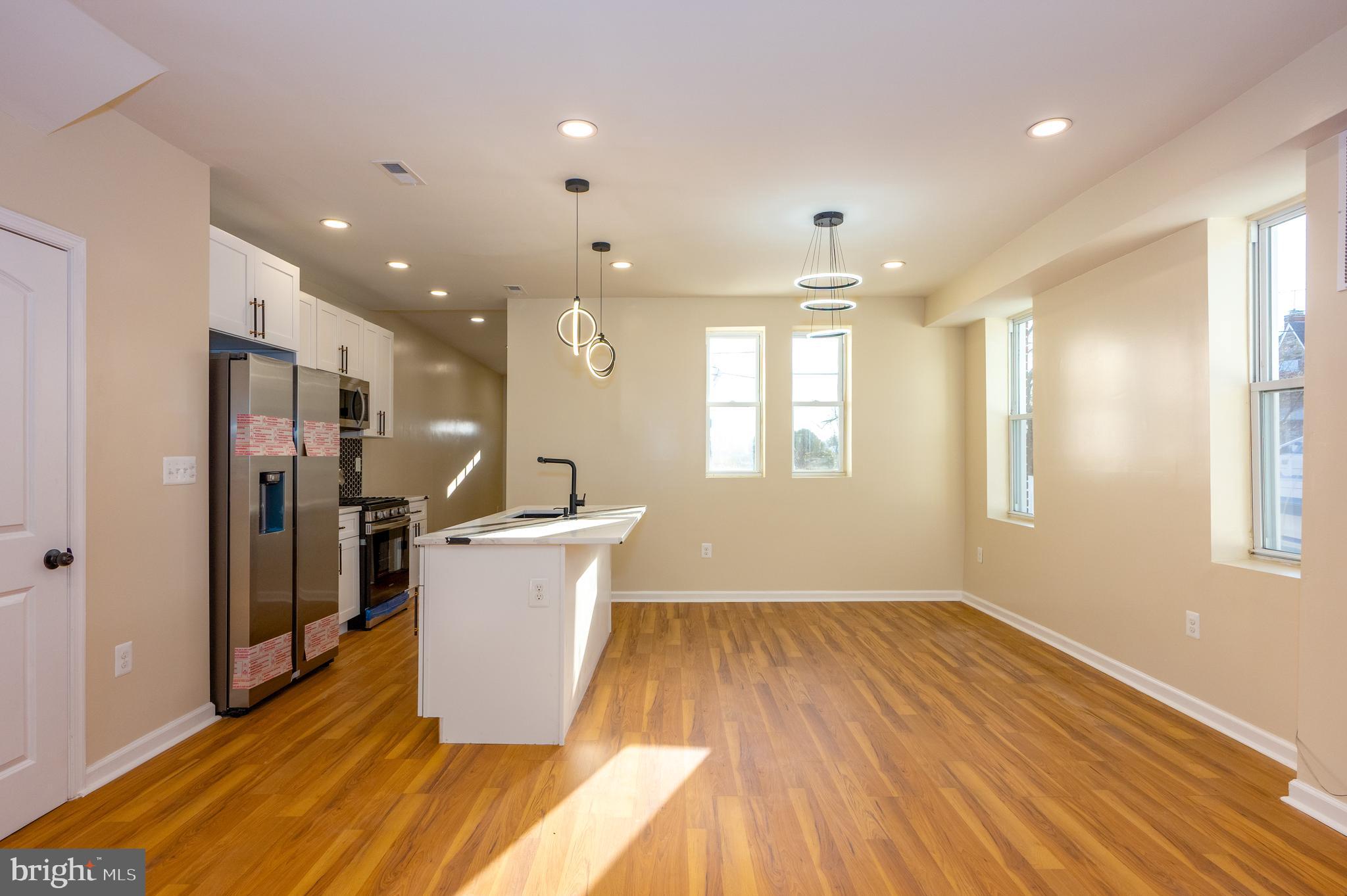 3121 Sequoia Avenue Baltimore, MD 21215 - Photo 7 of 30 a view of a kitchen with wooden floor and a window