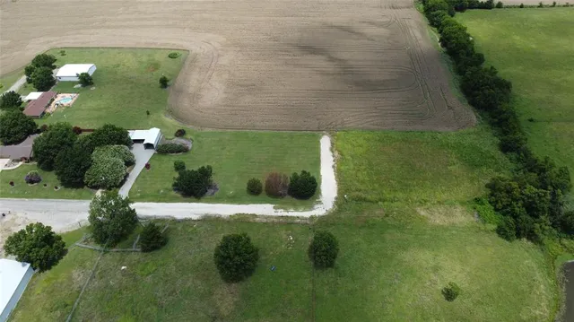 a aerial view of a house with a yard