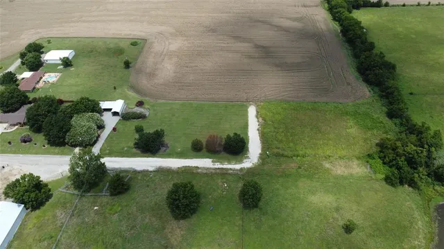 a aerial view of a house with a yard