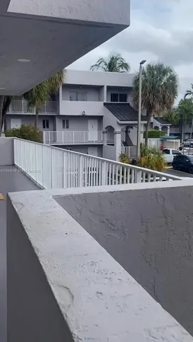 a view of a street with a building in the background