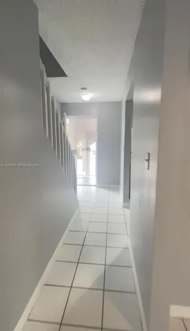 a bathroom with a shower and a mirror