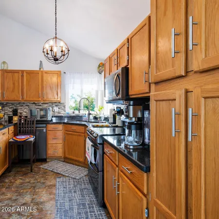 a view of a livingroom with workspace and a couch