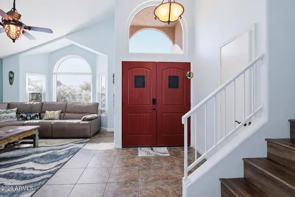 a view of a livingroom with furniture and entryway
