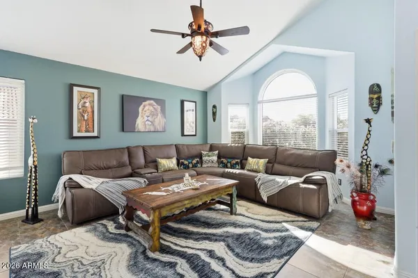 a dining room with furniture and window