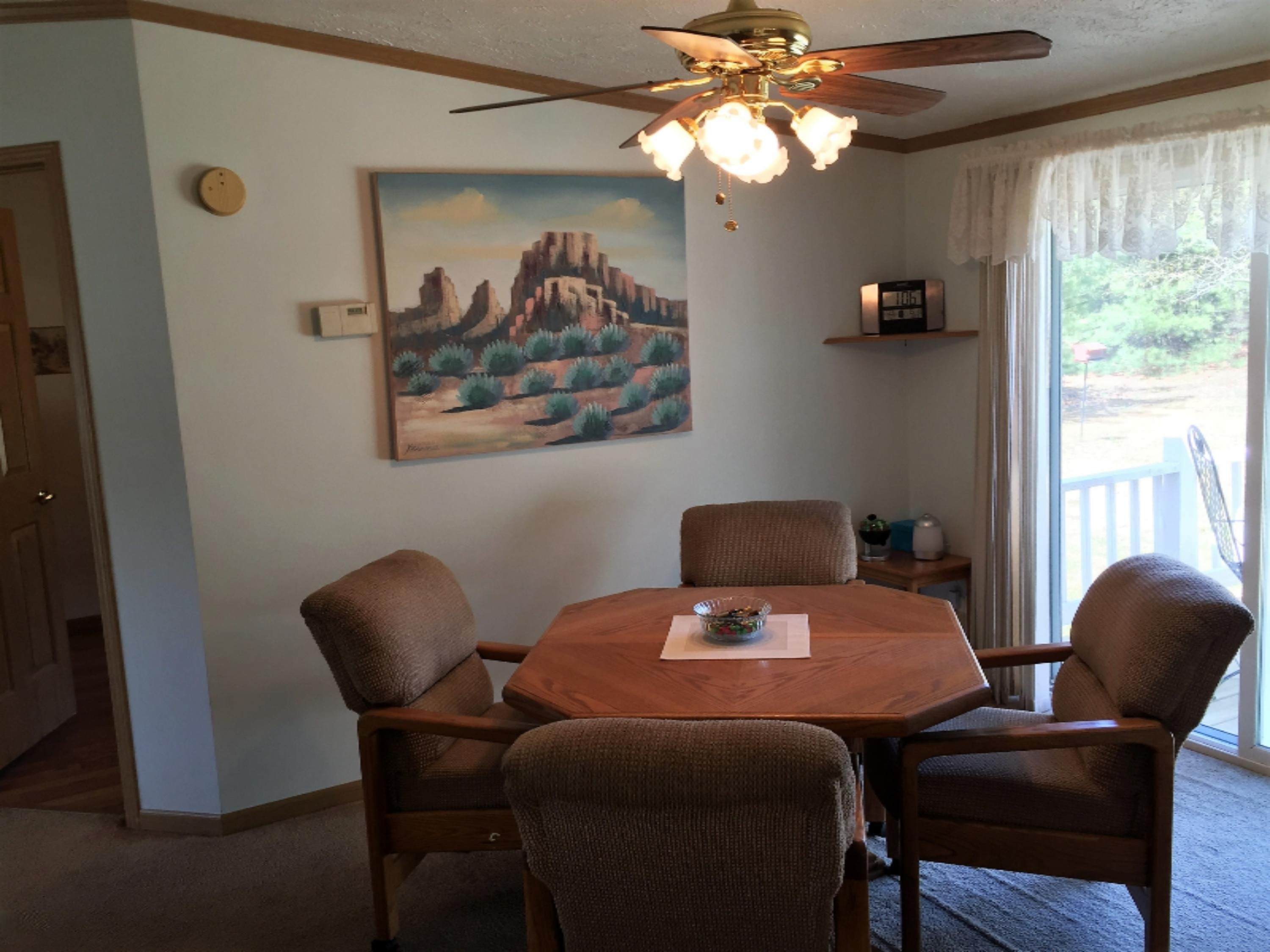 464 West Hoague Road Manistee, MI 49660 - Photo 9 of 27 Dining Area and Sliding Glass Door to De