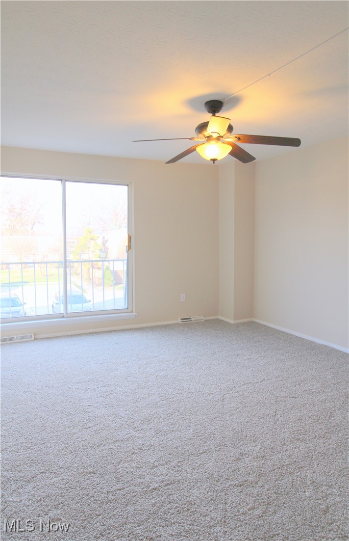 6476 State Road Cleveland, OH 44134 - Photo 13 of 26 Primary Bedroom with Neutral Paint, Carpet and Ceiling Fan in 2024. Walk In Closet and Private Sink/Vanity Area