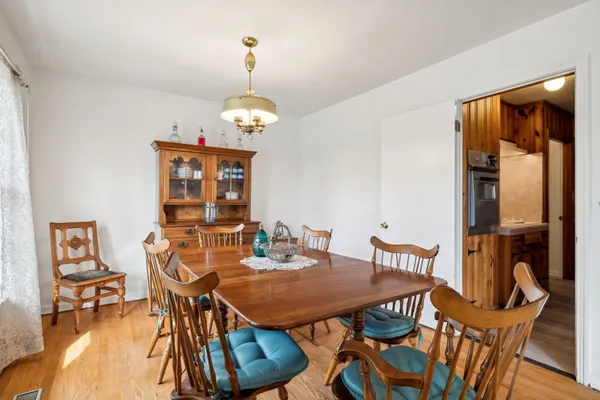 a large kitchen with stainless steel appliances a lot of counter space and a window