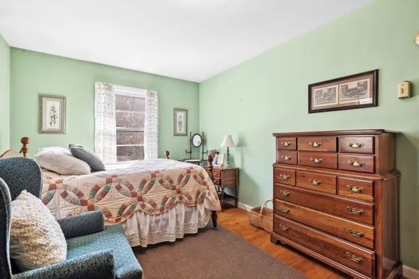 a living room with furniture and large windows