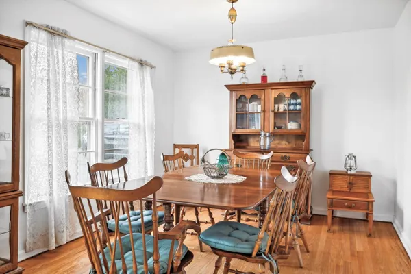 a kitchen with stainless steel appliances kitchen island granite countertop a sink stove and wooden cabinets
