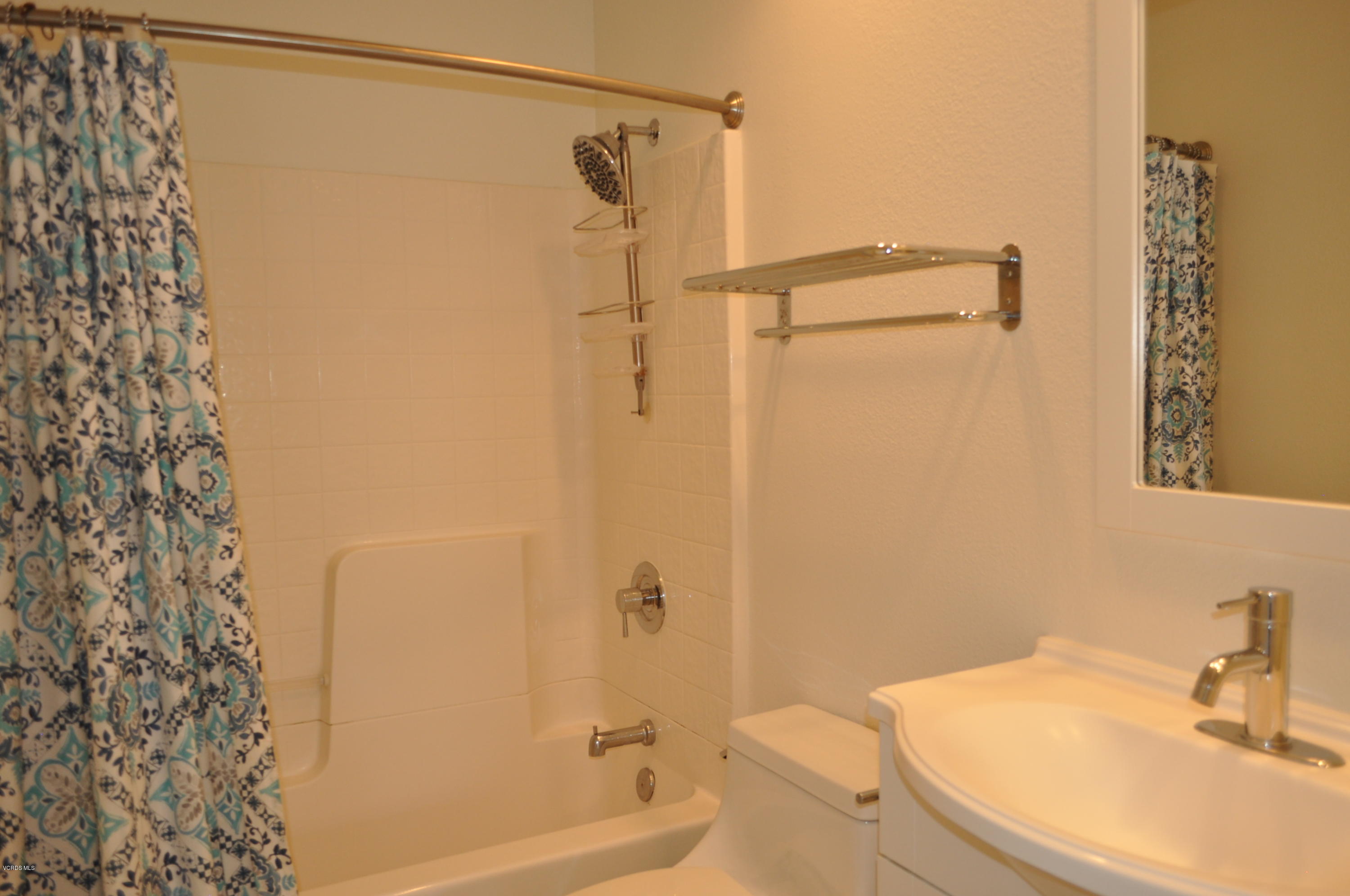 4852 Penrose Avenue Moorpark, CA 93021 - Photo 16 of 20 a bathroom with a sink and shower