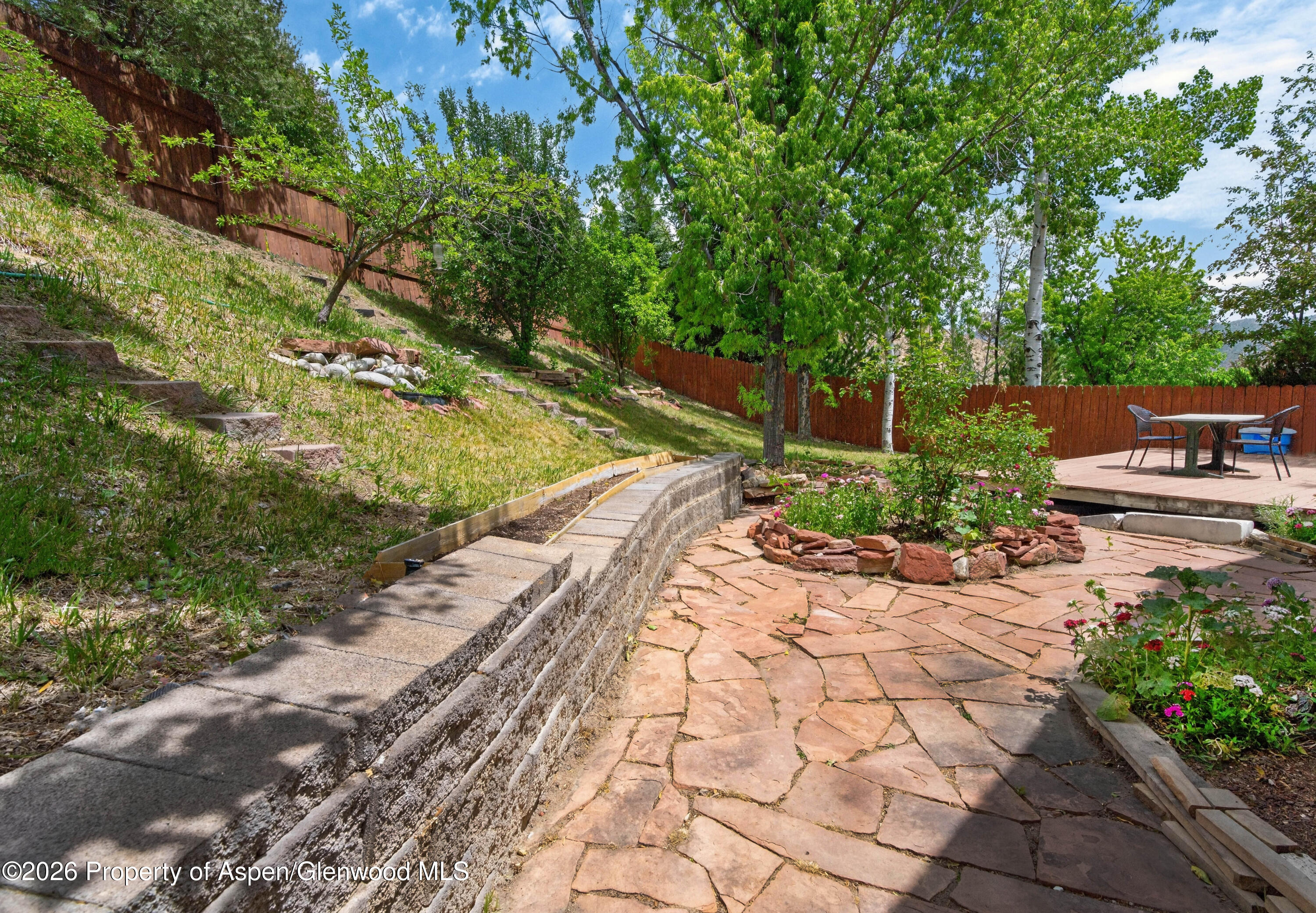 608 Lariat Loop New Castle, CO 81647 - Photo 28 of 32 a view of a backyard with potted plants and large trees