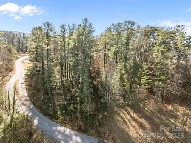 a view of a lake with houses in the back