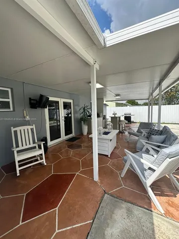 a view of kitchen with furniture and staircase