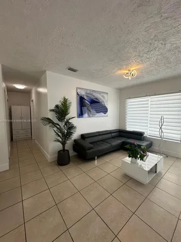 a bathroom with a sink a mirror and window