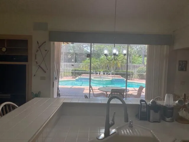 a swimming pool with outdoor seating