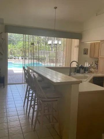 a kitchen with a table and chairs in it