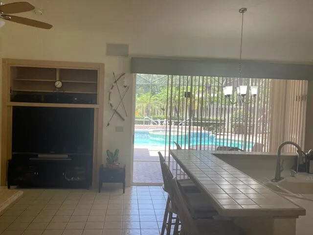 a view of a dining room with furniture and window