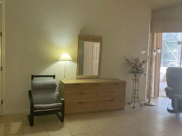 a room with furniture and a chair