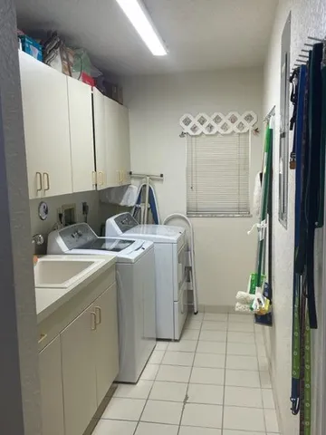 a view of a bathroom with a sink and a mirror