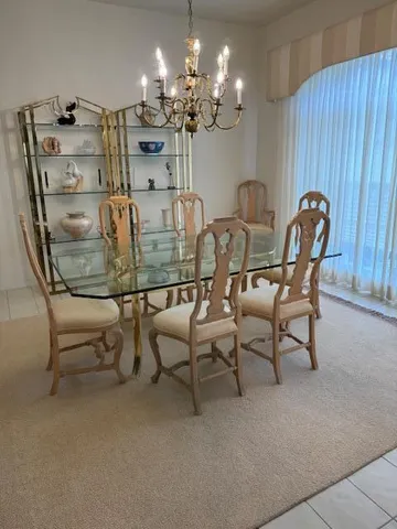 a view of a dining room with furniture and chandelier