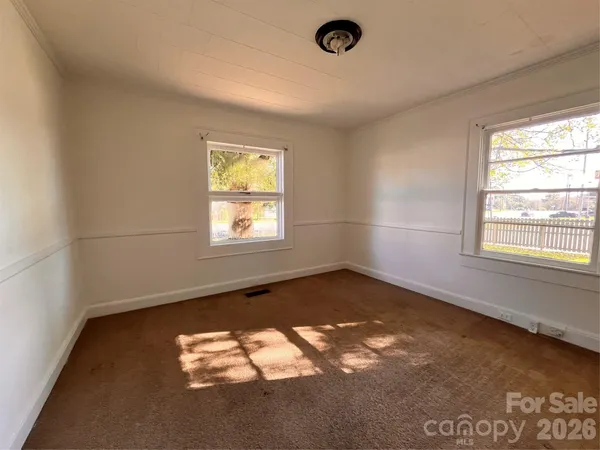 en empty room with windows