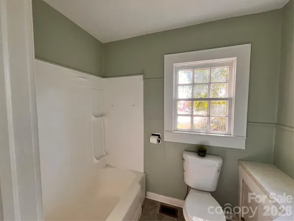 a bathroom with a toilet sink and bathtub