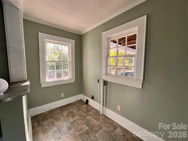 a view of a room that has a window in it