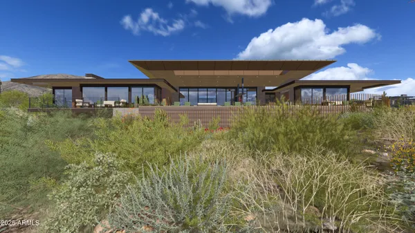 a front view of a house with yard porch and furniture