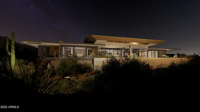a view of a patio with table and chairs under an umbrella