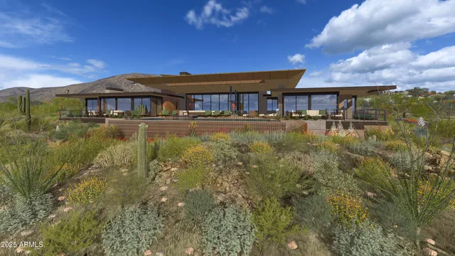 a view of a large pool with lawn chairs under an umbrella