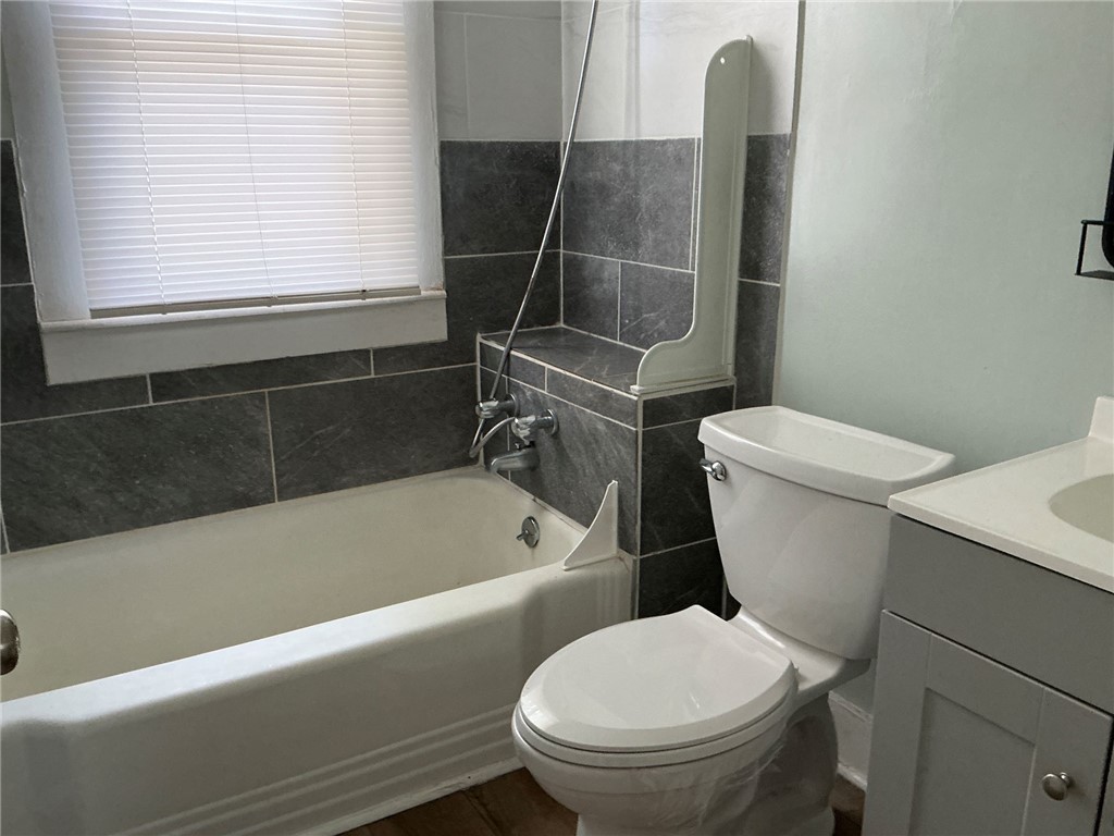 504 Caughlin Avenue Anderson, SC 29624 - Photo 12 of 15 Well-lit full bathroom with modern tiling and practical features.