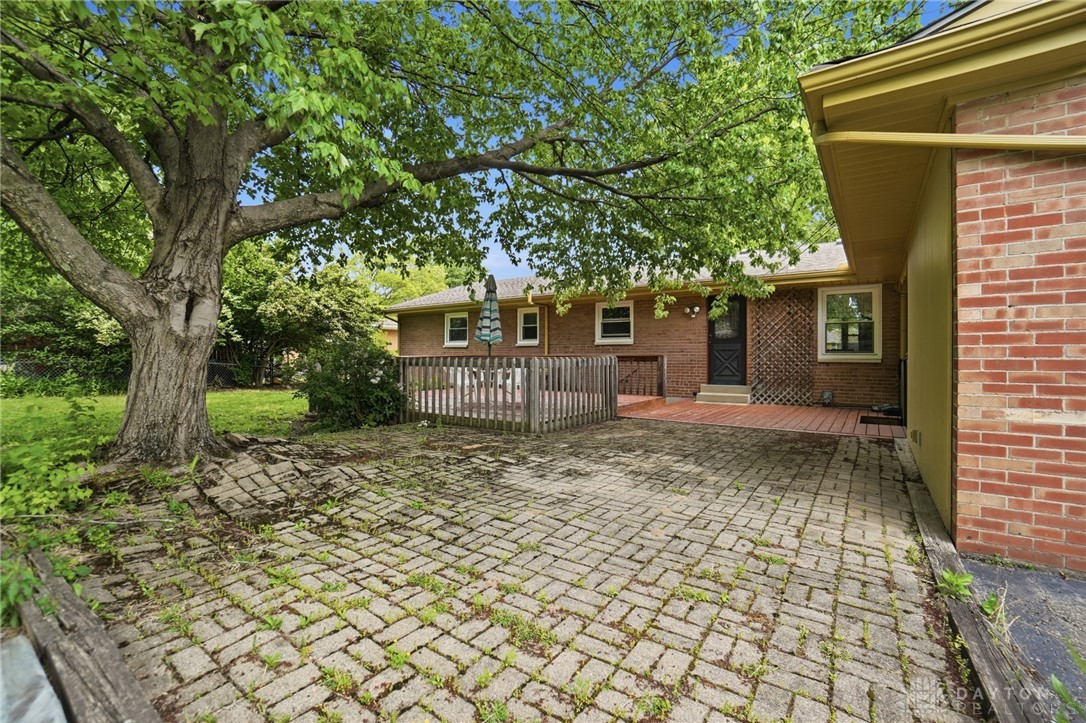 6119 Flemington Road Dayton, OH 45459 - Photo 60 of 76 This charming outdoor area offers both a wooden deck and a brick paver patio.