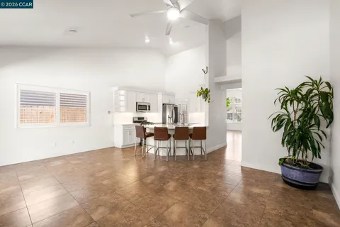 a kitchen with a sink appliances and cabinets
