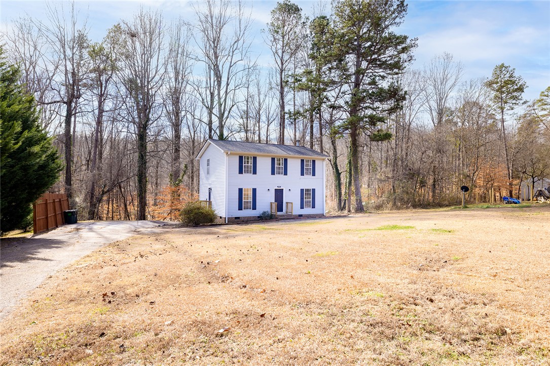 410 South Cove Road Seneca, SC 29672 - Photo 3 of 25 This charming home sits amidst natural surroundings, offering a peaceful retreat with a spacious yard.