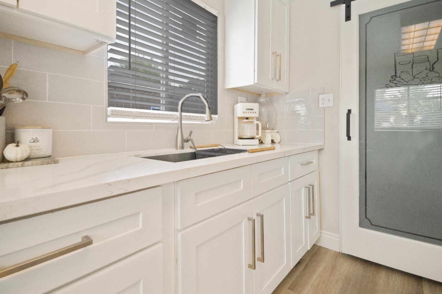 1403 East Griffith Way Fresno, CA 93704 - Photo 11 of 27 a bathroom with a sink and a mirror