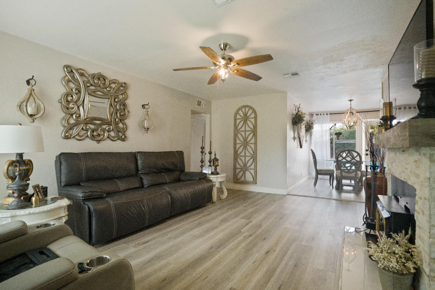 1403 East Griffith Way Fresno, CA 93704 - Photo 15 of 27 a living room with furniture and a wooden floor