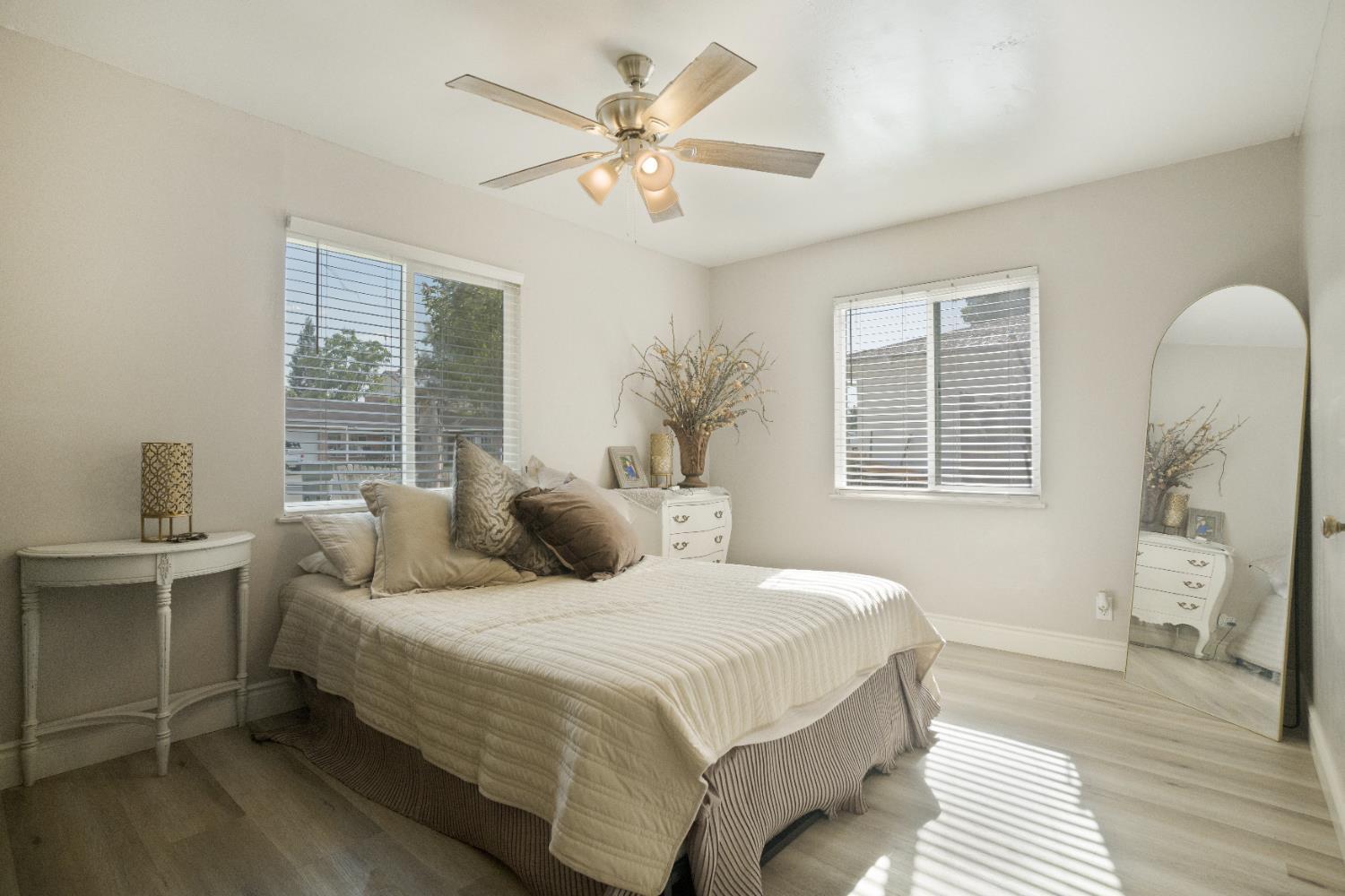 1403 East Griffith Way Fresno, CA 93704 - Photo 21 of 27 a bedroom with a large bed and a window