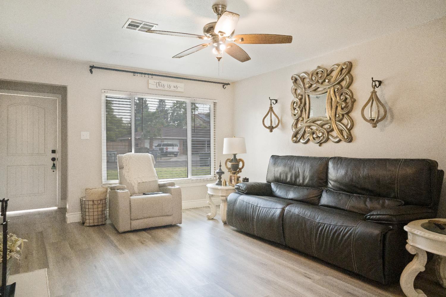 1403 East Griffith Way Fresno, CA 93704 - Photo 23 of 27 a living room with furniture and a large window