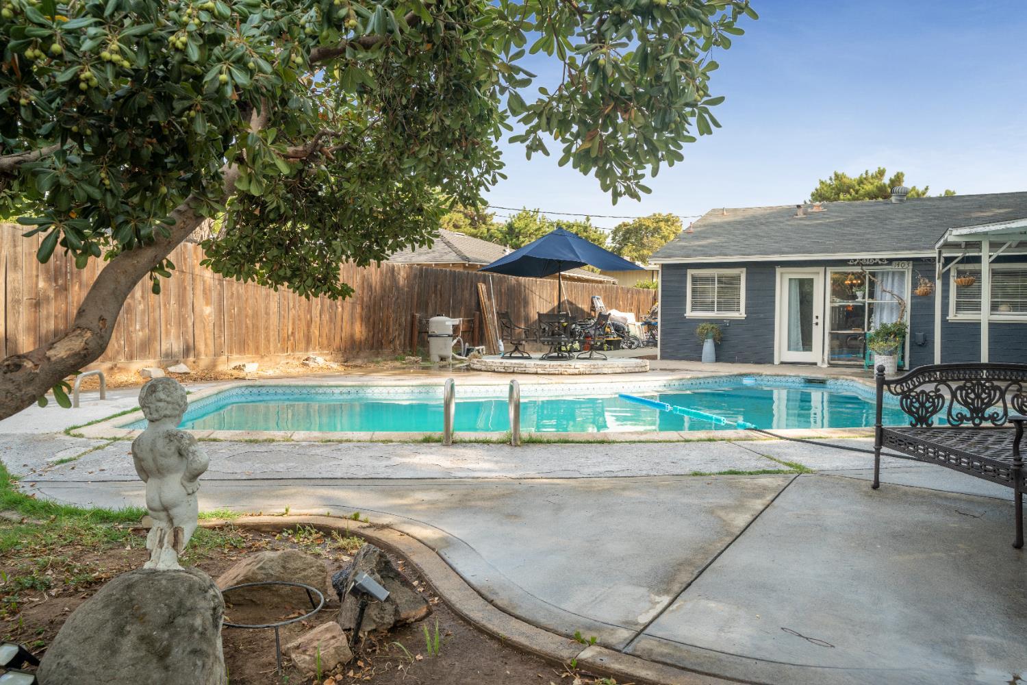 1403 East Griffith Way Fresno, CA 93704 - Photo 5 of 27 a house view with a backyard space