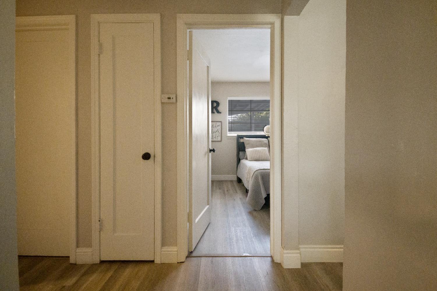 1403 East Griffith Way Fresno, CA 93704 - Photo 8 of 27 a view of a bathroom from a hallway