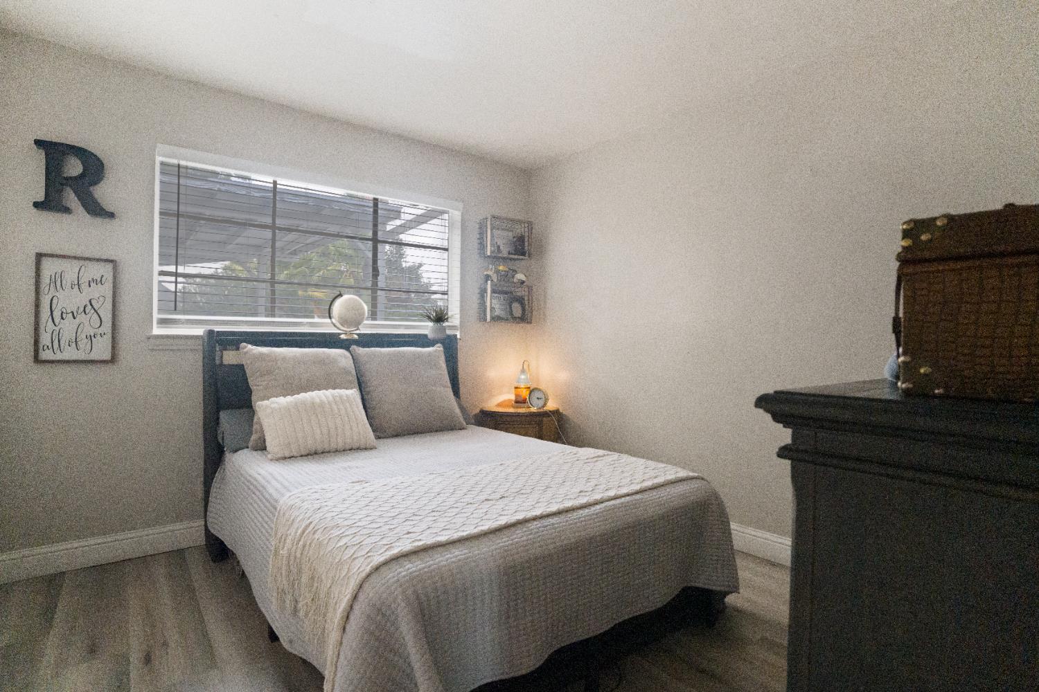 1403 East Griffith Way Fresno, CA 93704 - Photo 9 of 27 a bedroom with a bed and window