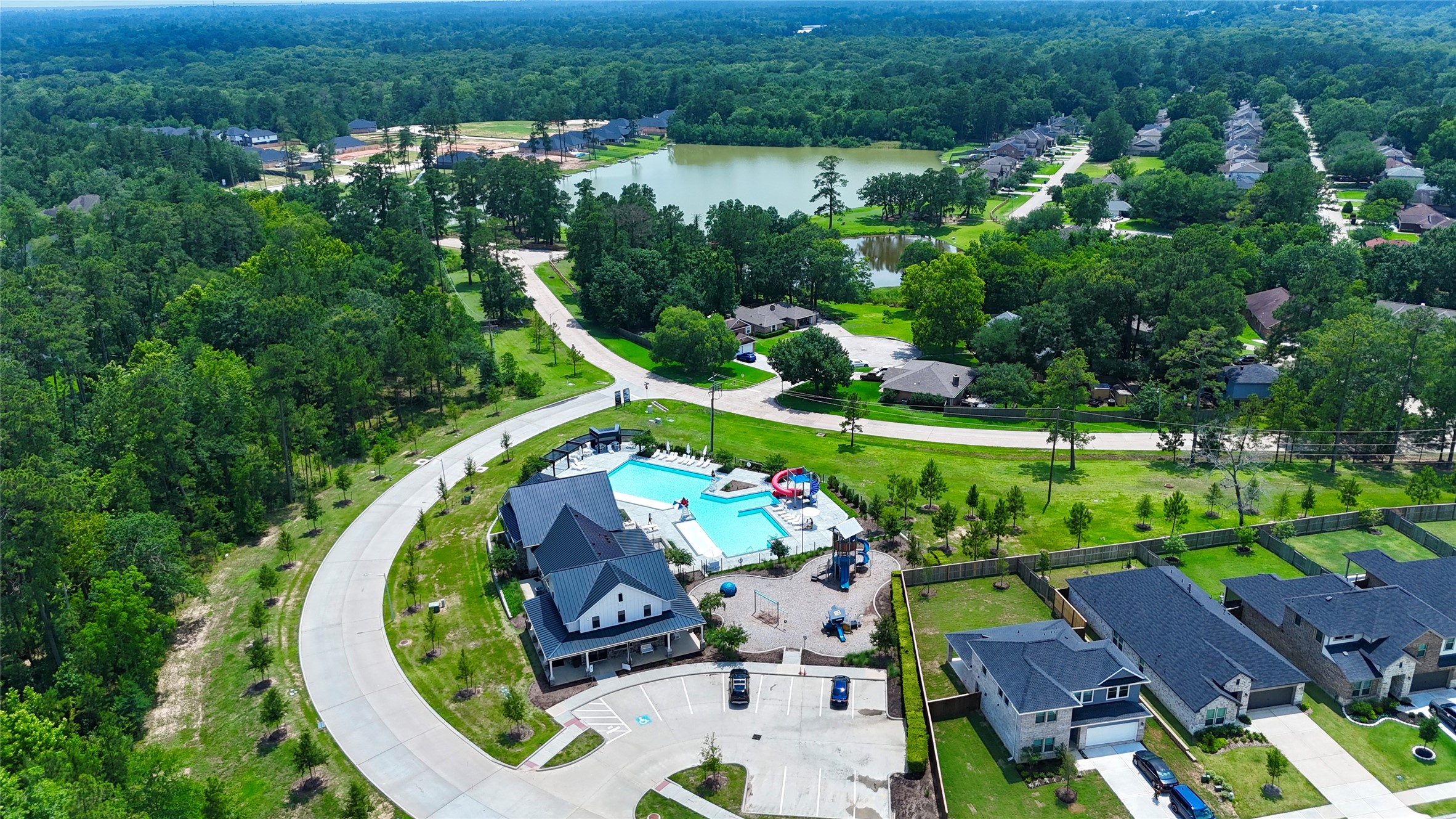 12198 Ridge Top Drive Conroe, TX 77304 - Photo 26 of 27 an aerial view of a swimming pool patio and outdoor seating